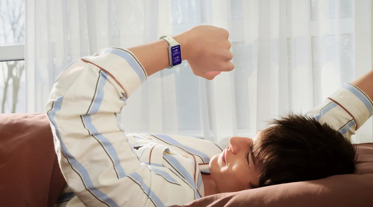 A man checking his band after waking up