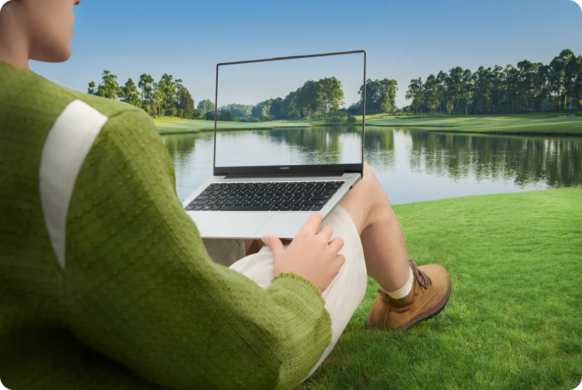 With the laptop by a lake
