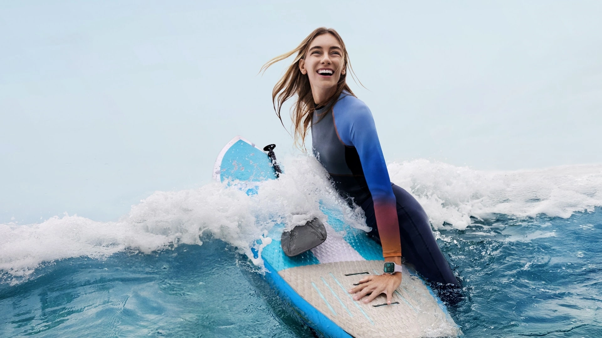 A woman surfing a wave